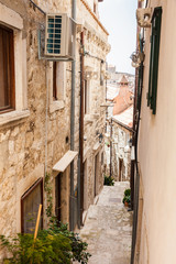 Fototapeta na wymiar The beautiful steep alleys at the walled old town of Dubrovnik