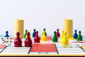 parcheesi game set upon board with white background