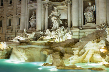 Fontana di Trevi, Trevi Fontain illuminated at night. Long exposure, stone statues and sculptures...