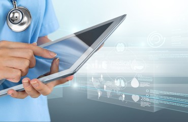 Close-up Doctor at hospital working with tablet pc