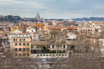 Fototapeta na wymiar Residential buildings and facades, italian architecture, view from the observation deck on the houses with windows with shutters, streets, roadway. View from above in the park in Rome, Italy.