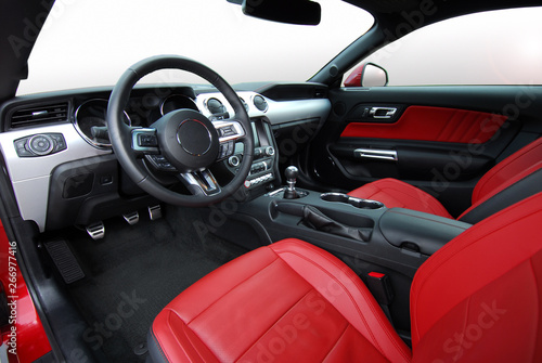 red leather interior of luxury red sport car