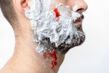 Shaving wounded, blood on man face