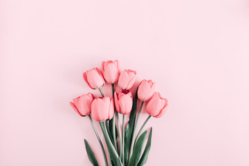 Beautiful composition spring flowers. Bouquet of pink tulips flowers on pastel pink background. Valentine's Day, Easter, Birthday, Happy Women's Day, Mother's Day. Flat lay, top view, copy space - obrazy, fototapety, plakaty
