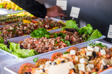 Fresh fish food and vegetables for catering and restaurant exposition concept business - coloured background with healthy meal exposed with notes