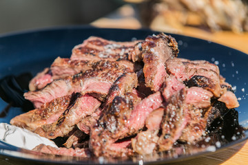 Fresh, delicious grilled meat. Grilling steak on BBQ. Close up view of grilling steak