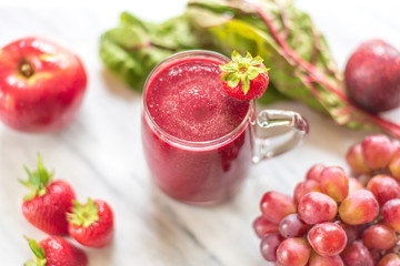 Red smoothie made from fresh healthy ingredients
