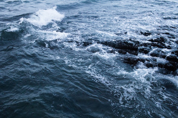 Dark blue nothern ocean waves in winter. Water surface