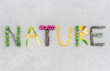 Nature written with leaves and flowers