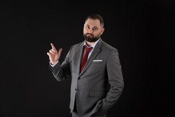 young bearded business man with pointing gesture