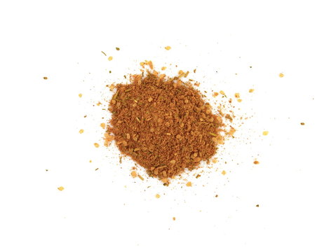 Grounded spice ingredient of dry mix vegetables isolated on white. Chicken spices. A pile of a yellow spice mix. Spices consist dried dehydrated vegetables carrot paprika onion garlic parsnip parsley 