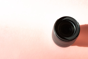 The lens for the camera on a pink background