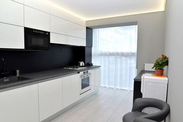 Modern kitchen in gray-black tones. Interior