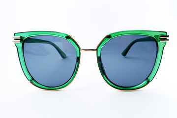 Sun glasses in green plastic rim