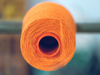 Spools of thread on weaver loom