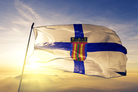 Coptic church flag waving on the top sunrise mist fog