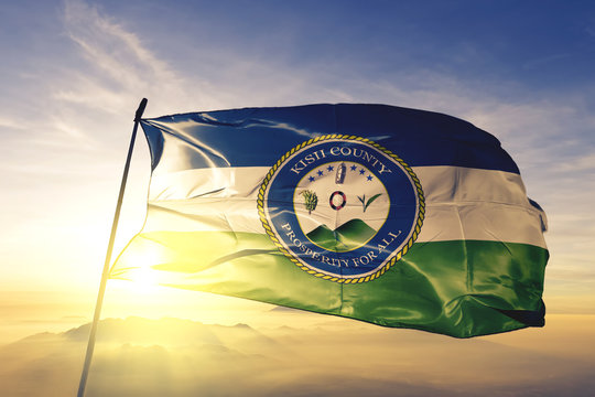 Kisii county of Kenya flag waving on the top sunrise mist fog