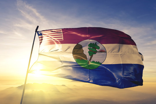 Nimba county of Liberia flag waving on the top sunrise mist fog