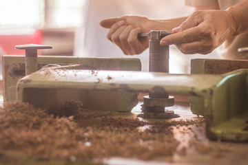 hands handling wood 