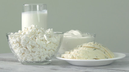 A group of environmentally friendly non-GMO dairy products, yogurt, cottage cheese, sour cream and cheese on the bottom of the pod.
