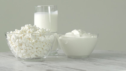 A group of environmentally friendly non-GMO dairy products, yogurt, cottage cheese, sour cream and cheese on the bottom of the pod.