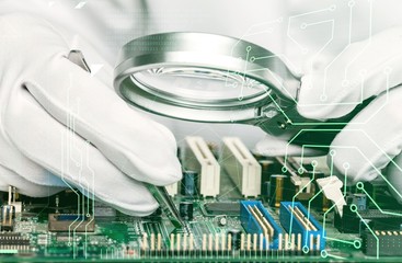 Man repairing electronic mother board of computer