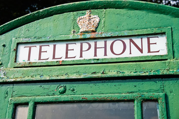 Fototapeta premium Telephone box which has been painted green, traditionally done in Ireland.