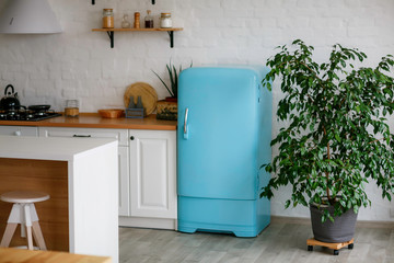 Luxurious white kitchen and living room in a big house
