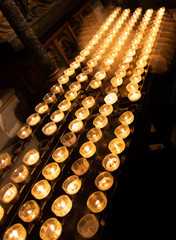burning candles in the cathedral.