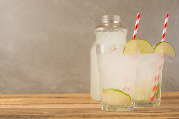 Summer cool drink, lemonade with lime and ice, two glasses with space, summer mood, refreshing drink, freshness