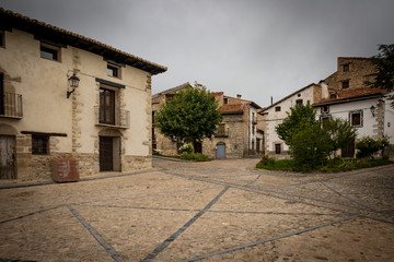 square with typical architecture in Fortanete town, province of Teruel, Aragon, Spain