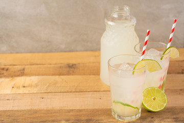 Summer cool drink, lemonade with lime and ice, two glasses with space, summer mood, refreshing drink, freshness