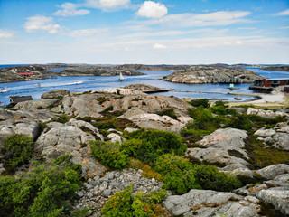Fototapeta na wymiar Skarhamn harbor on a sunny summer day. Located on the Bohuslan Coast, Tjorn, Vastra Gotaland County in Southwestern Sweden.