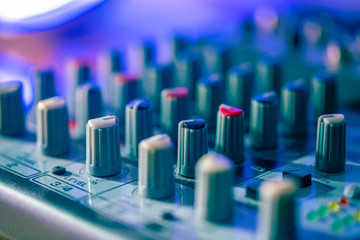 Close up of a pro mixing desk in a home recording studio