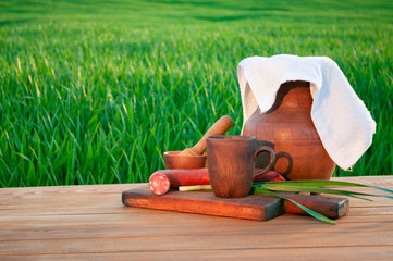 Vintage still life against the background of the green field