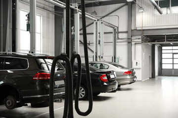 View of modern automobile repair shop with cars