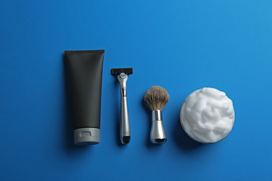 Flat lay composition with men's cosmetic products on color background. Space for design