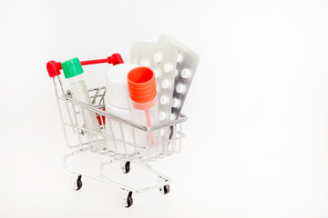 medicine pills and tube in shopping cart