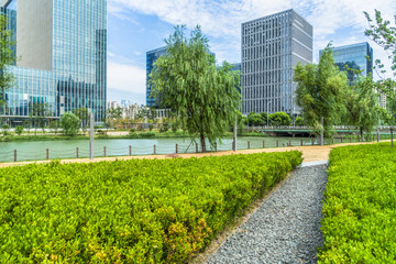 beautiful green field near modern office building.