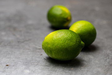 three limes on metal surface