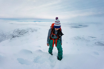 Fototapeta na wymiar Trekking on a snowy mountain