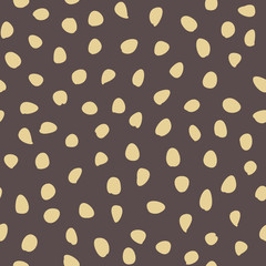 Seamless background with random elements. Abstract ornament. Dotted abstract brown and golden pattern