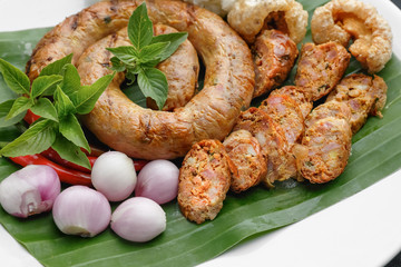 Northern Thai Sausage or Sai-Aua , filled with chopped lemongrass, galangal, kaffir lime, coriander and red curry paste.