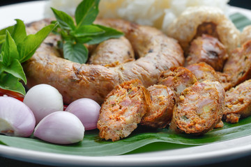 Northern Thai Sausage or Sai-Aua , filled with chopped lemongrass, galangal, kaffir lime, coriander and red curry paste.