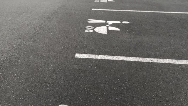 Upward pan of specially allotted parking spots for vehicles with baby prams