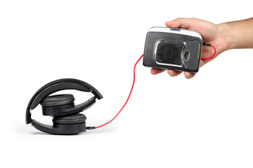 hand of a man holding a player walkman