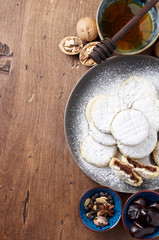 Arabic homemade cookies filled with dates and walnuts covered powdered sugar