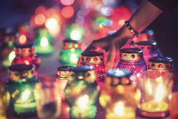 Laying candles in memory of those killed in disasters, war and global cataclysms