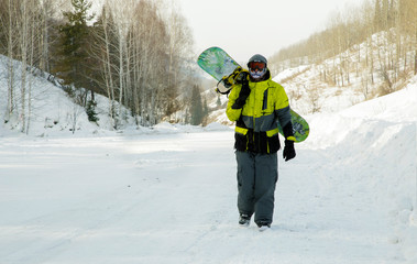 Walking snowboarder