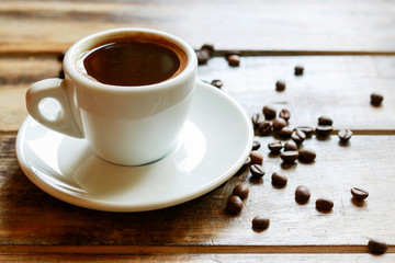 Cup of coffee on brown wooden table